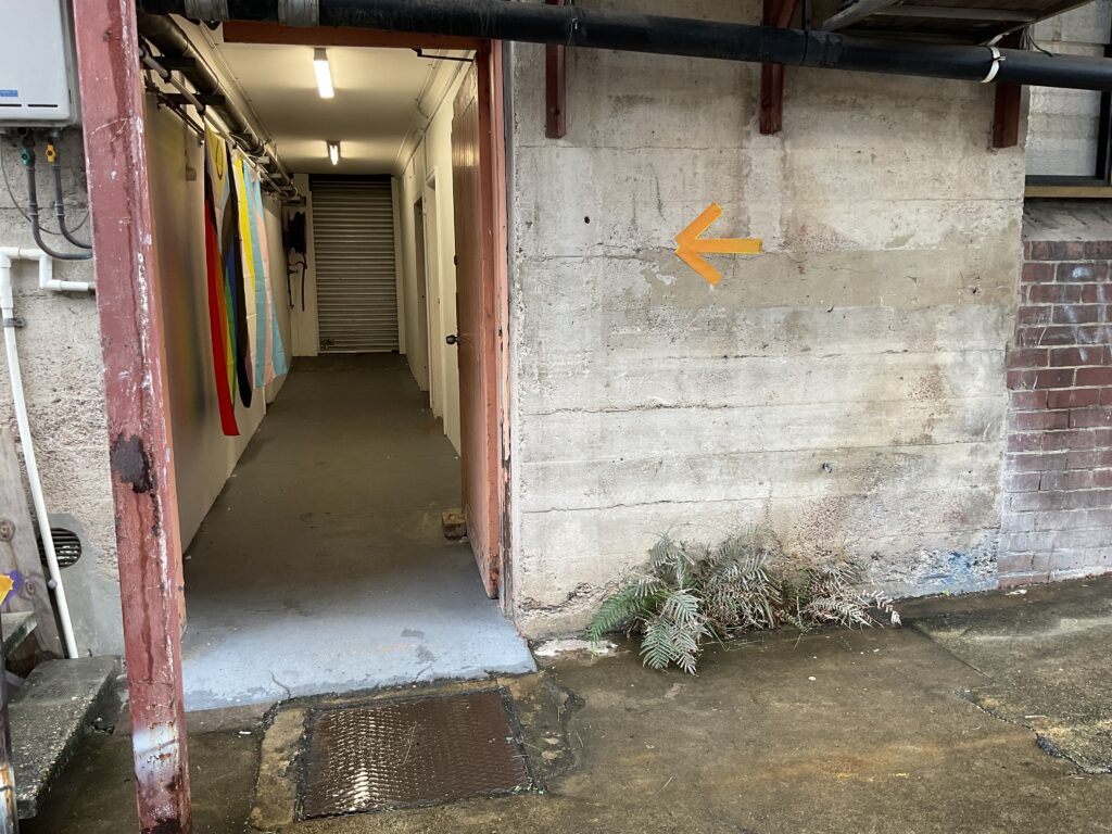 Shows large accessible entrance to Cyber Bunker venue.