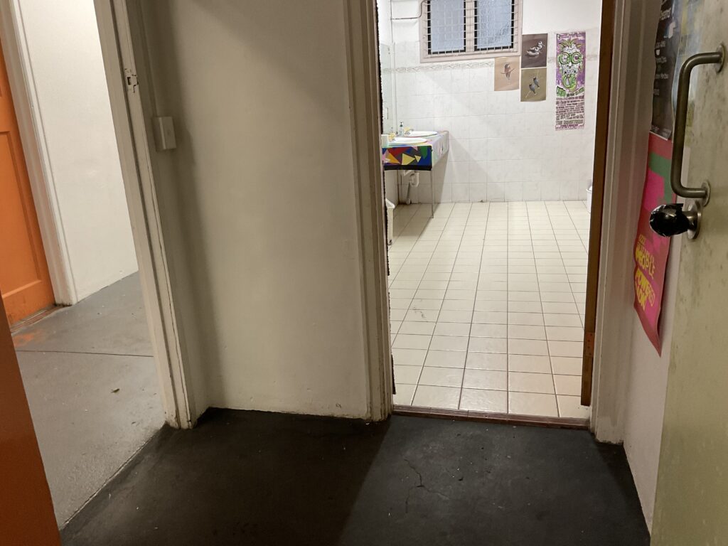 Entrance to all-gender/unisex bathroom.